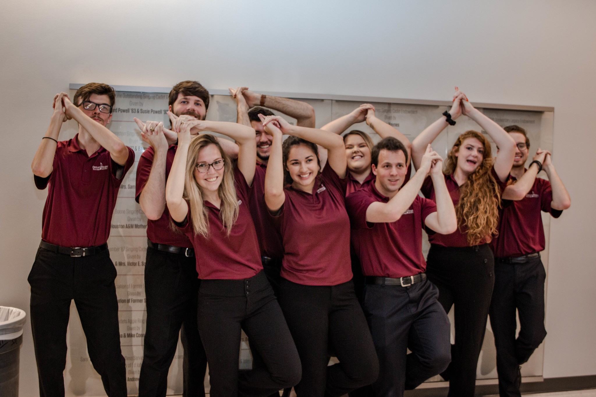 Image of Century Singers in polos and black pants whooping