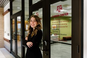 Hannah Bailey poses in front of the Career Center entrance