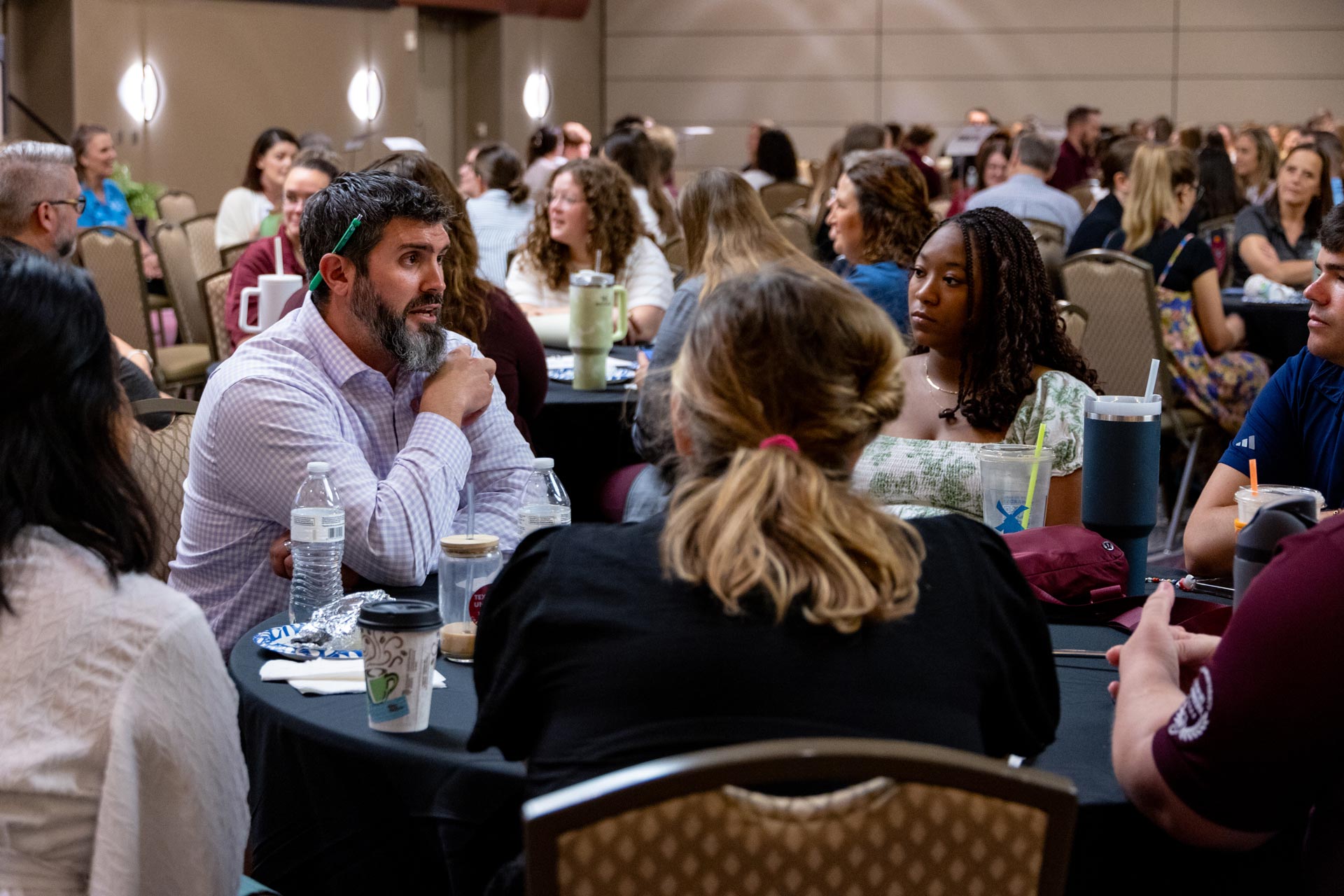 DSA staff engaging in a roundtable discussion during a division staff meeting.
