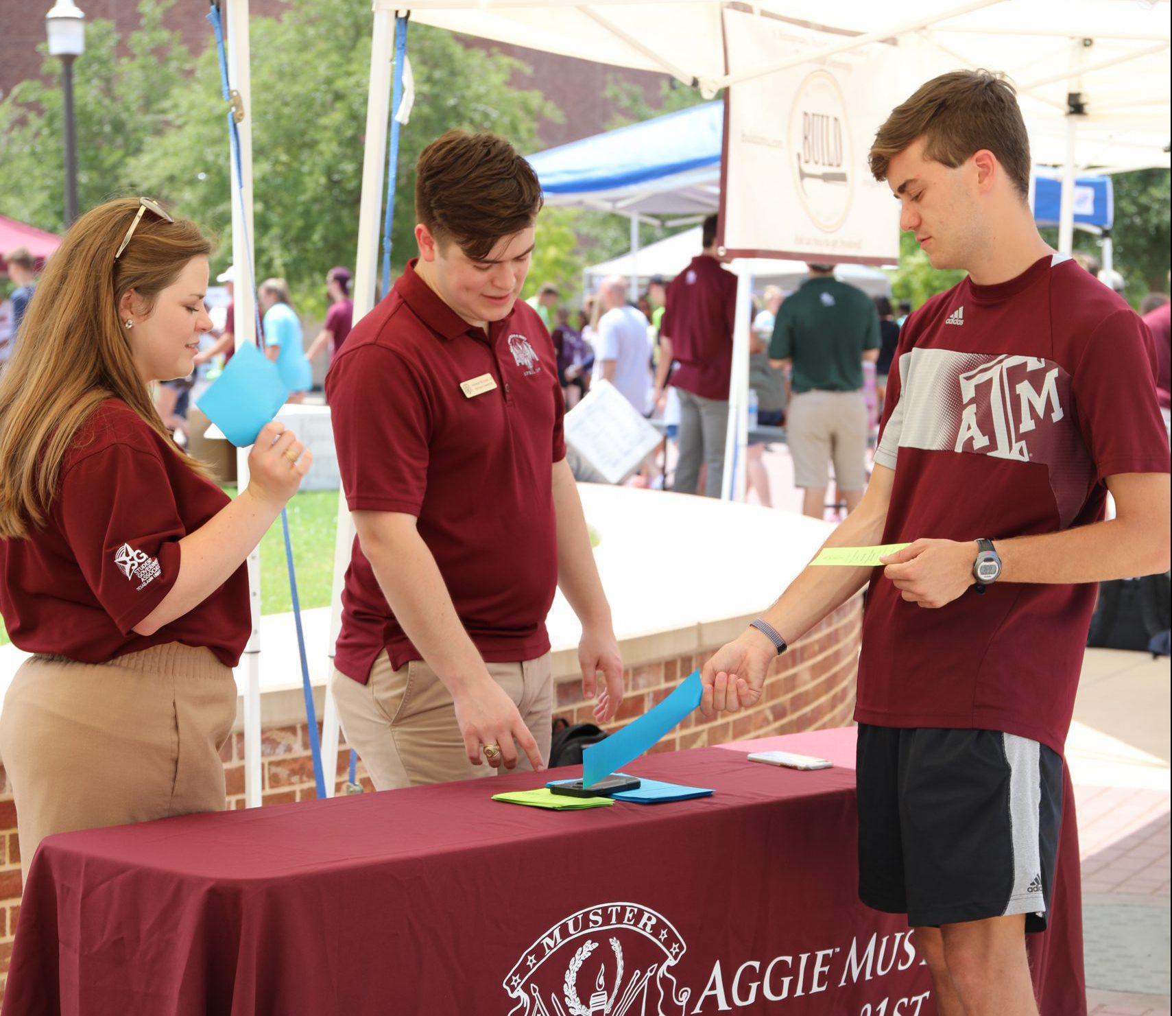Image of Student in front of a student organization booth