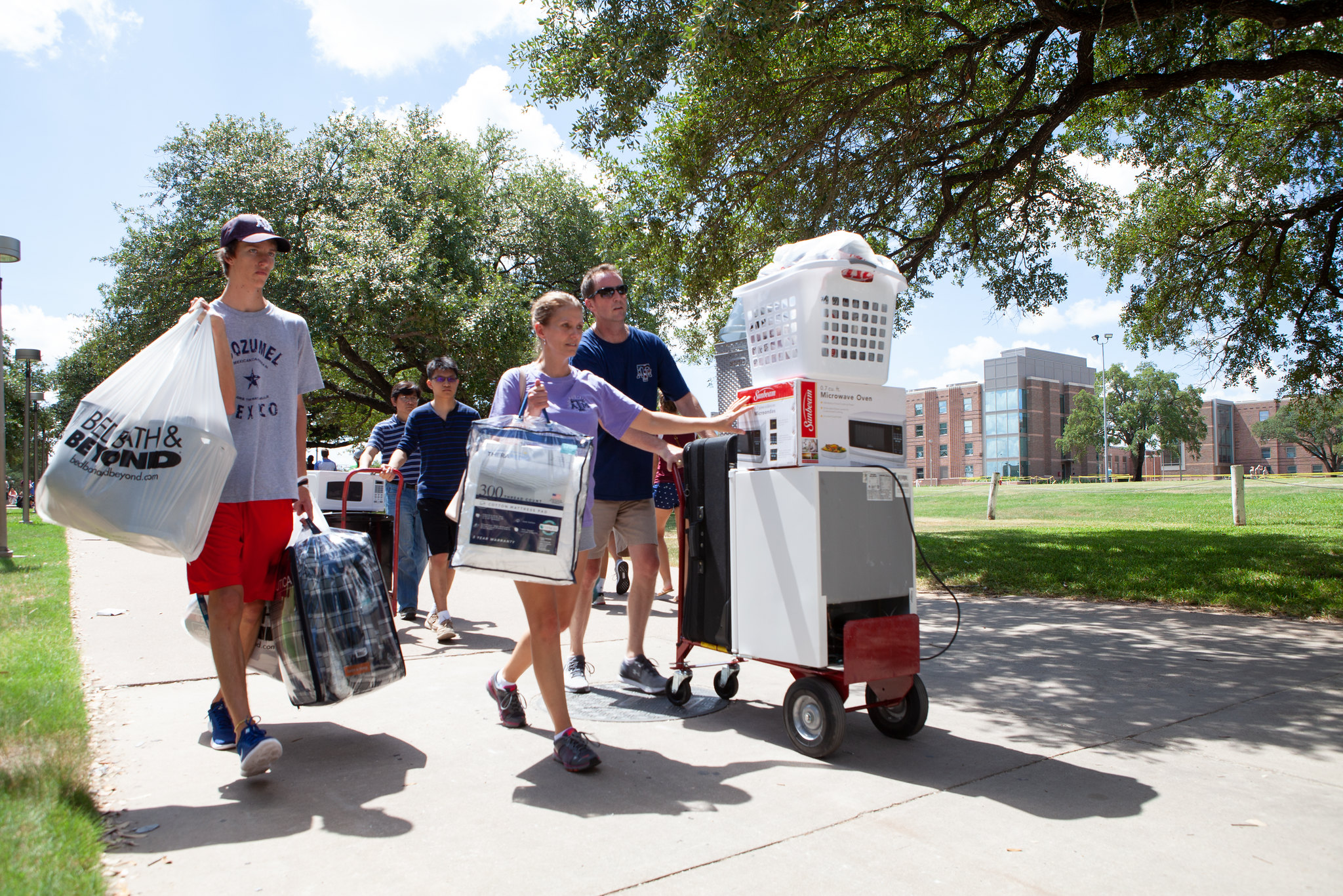 Stock image of students moving in to on campus housing