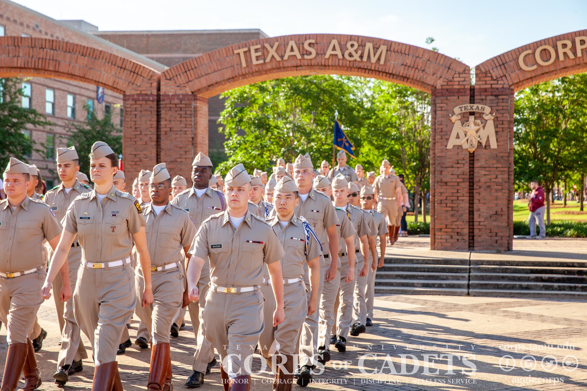 Image of Corps of Cadets marching down campus. 