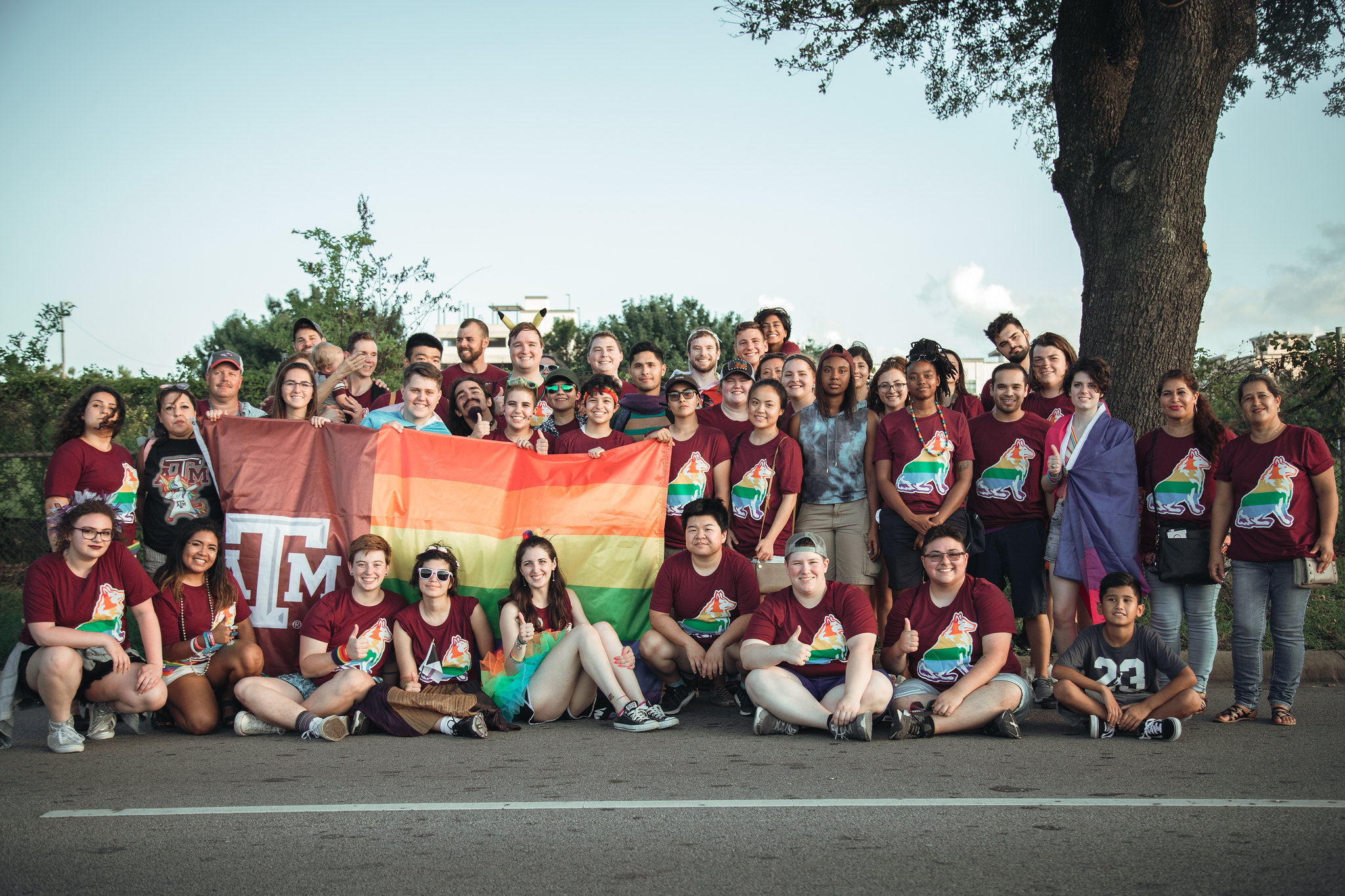 Image of students holding an A&M LGBTQ+ flag.