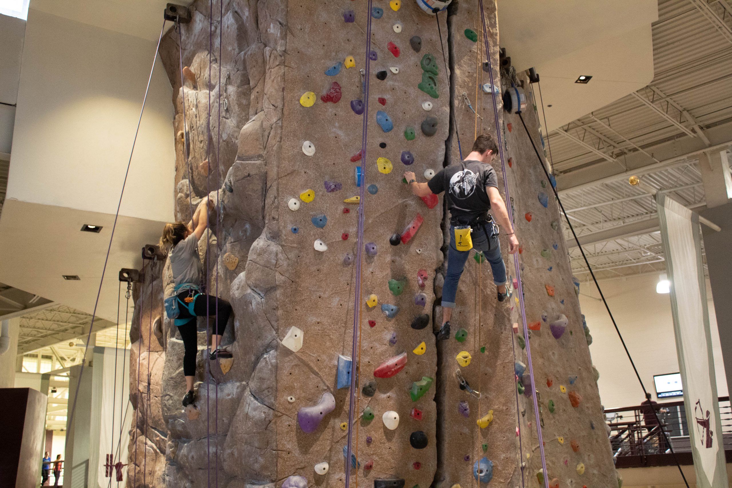 RecSportsLeadership Image of students rock climbing at the Rec Center