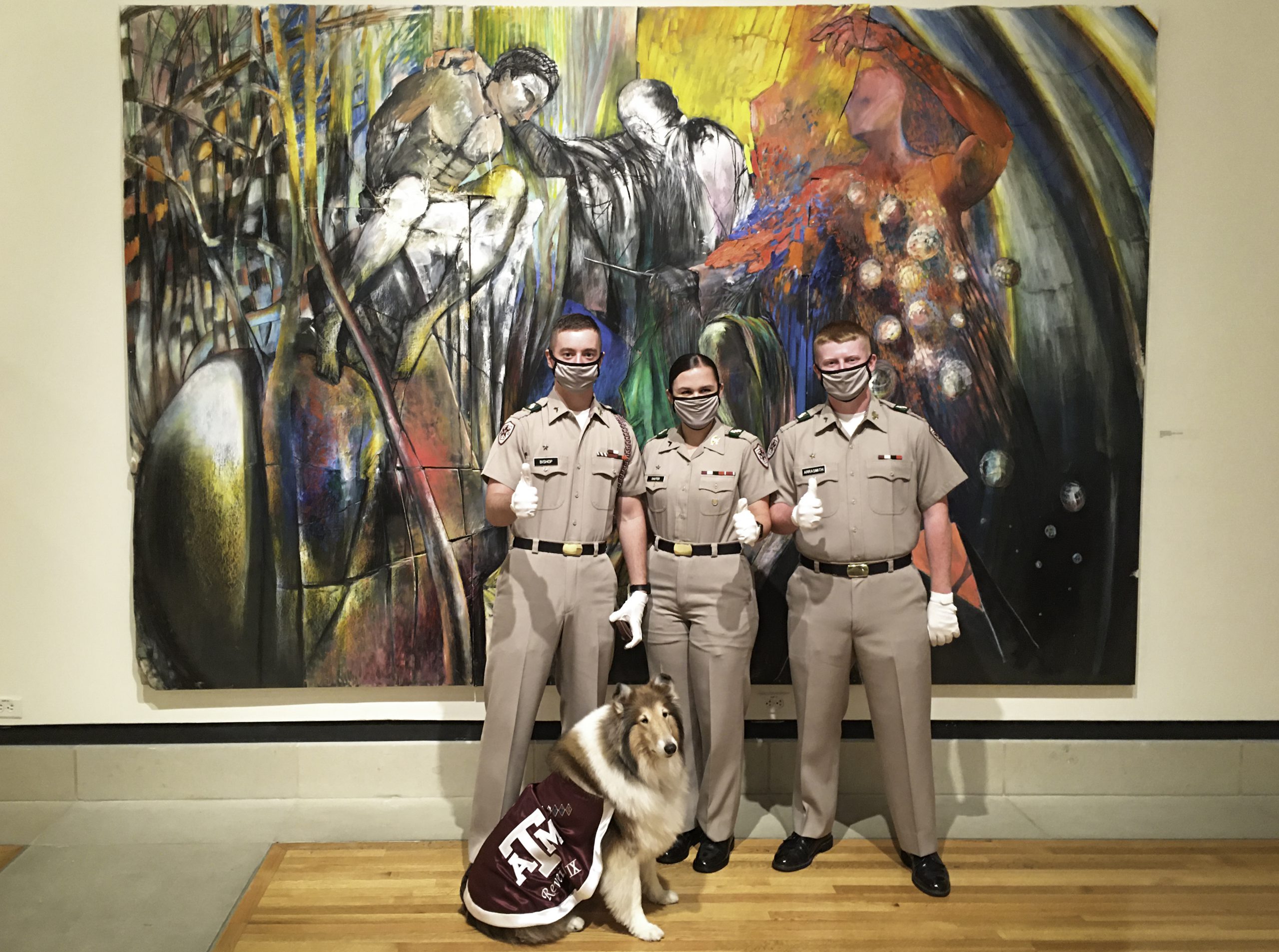 Image of Reveille and cadets in front of a painting at the Stark Gallery