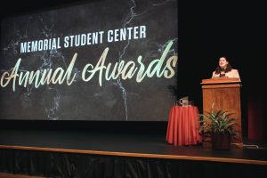 Image of a speaker behind a podium at the Memorial Student Center Annual Awards