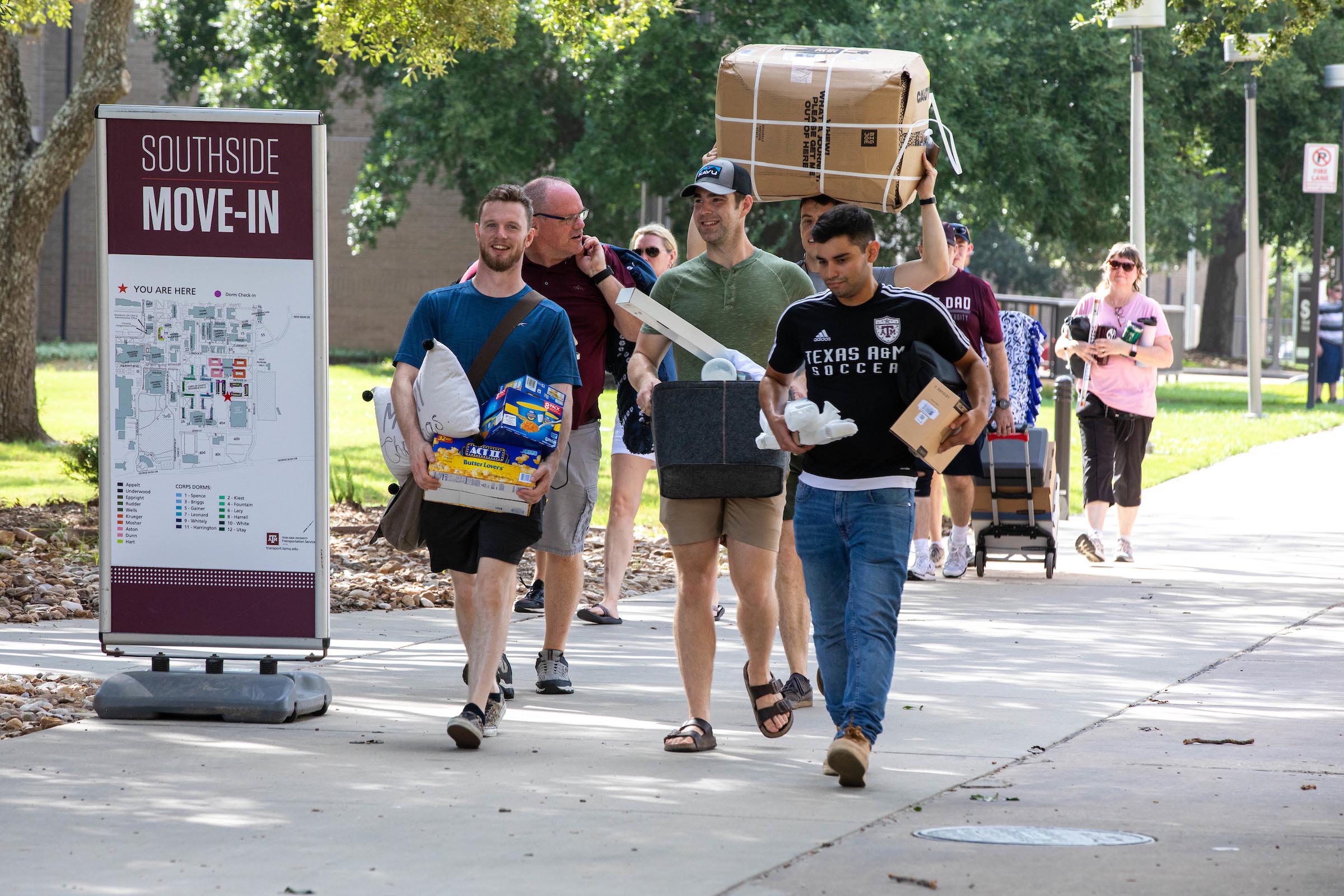 Photo of students carrying boxes during move-in weekend