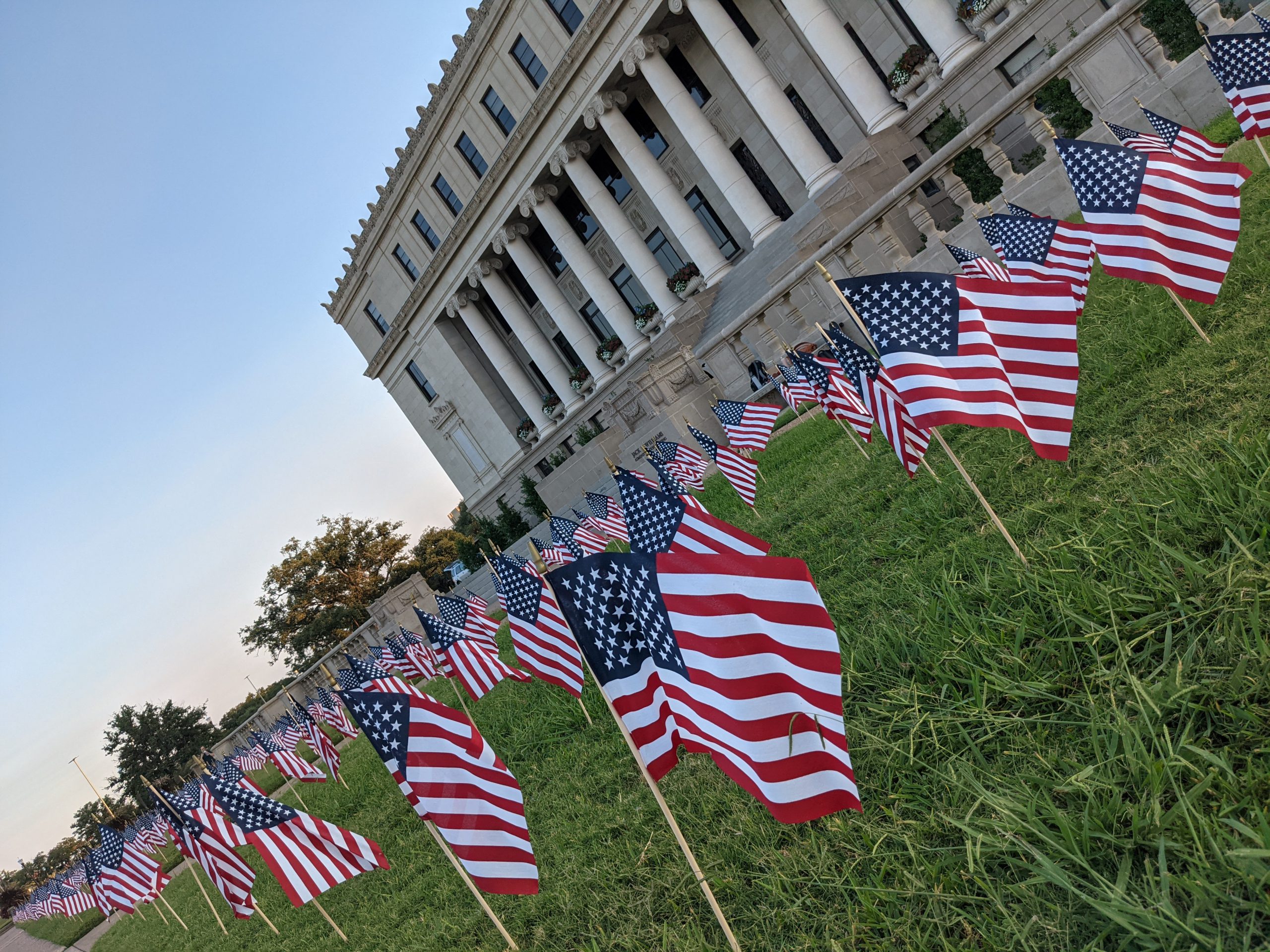 Rows of U.S. flags decorate the lawn in front of the Jack K. Williams Administration Building