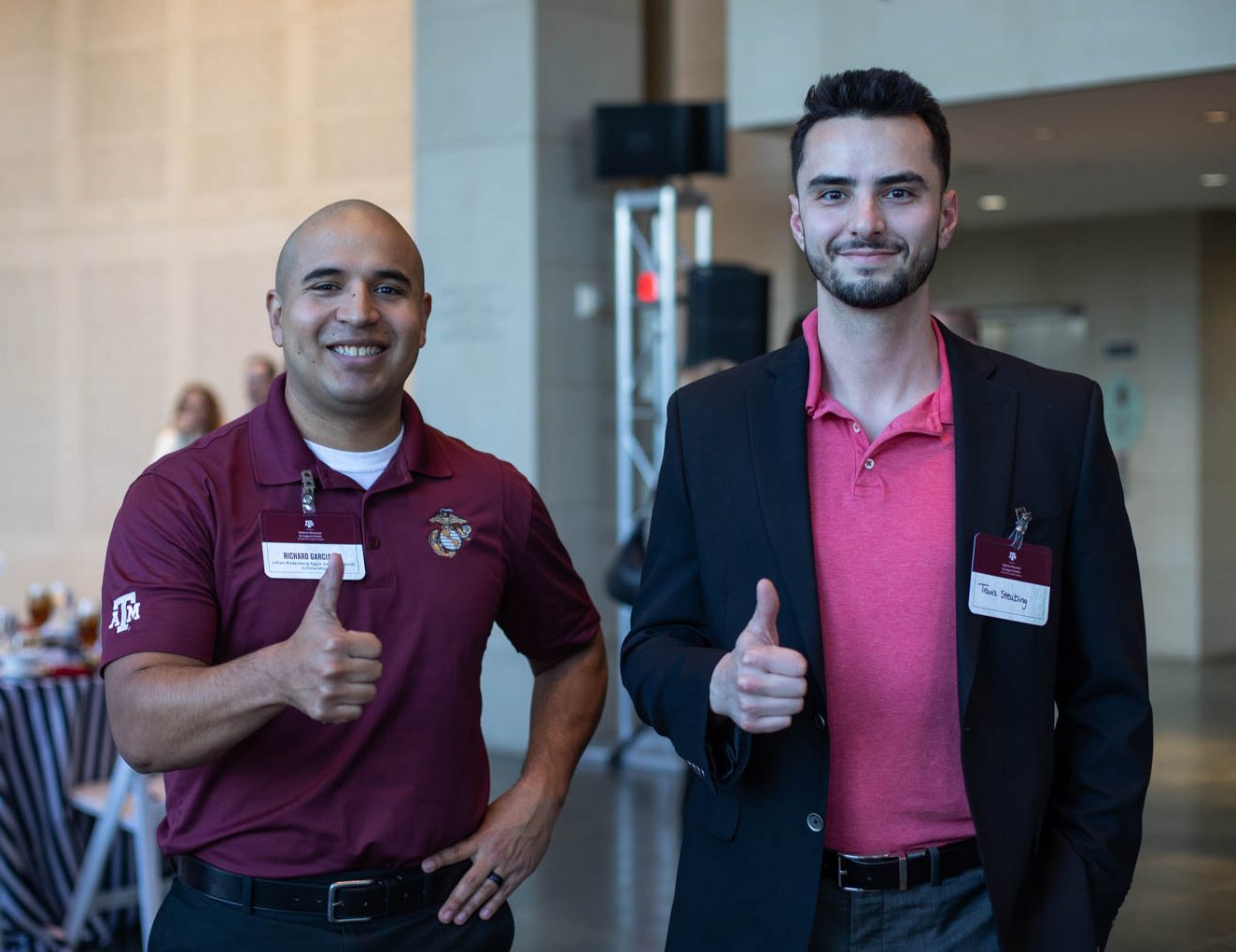 students give a gig 'em at the previous VRSC scholarship dinner