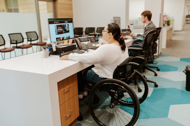 Photo of Brianna Bazan at the Disability Resources front desk.