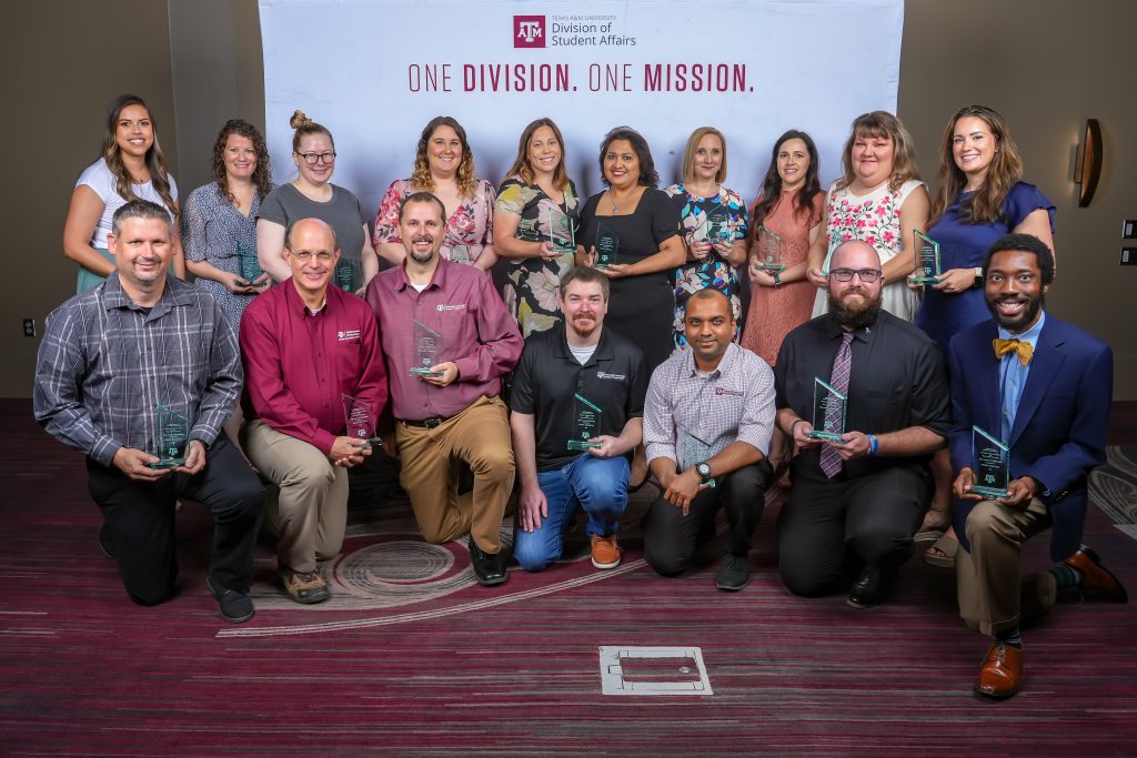 Photo of the In Person New Student Conferences Implementation Team holding their DSA awards