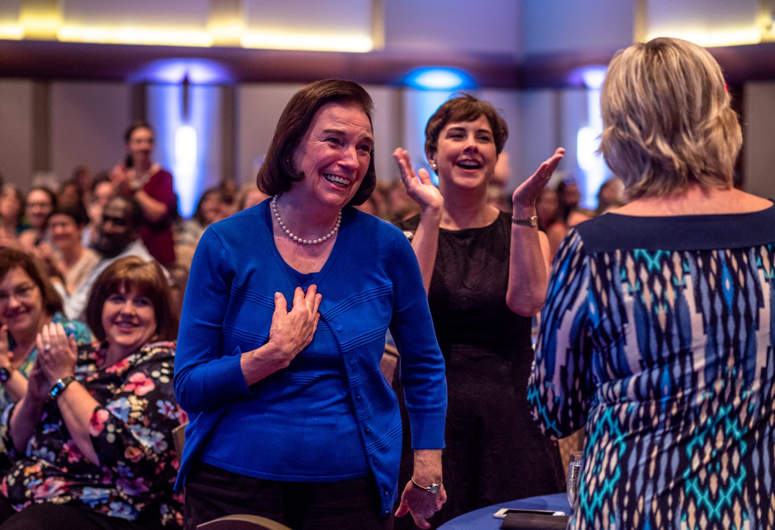 Woman smiling in crowd at the DSA awards event