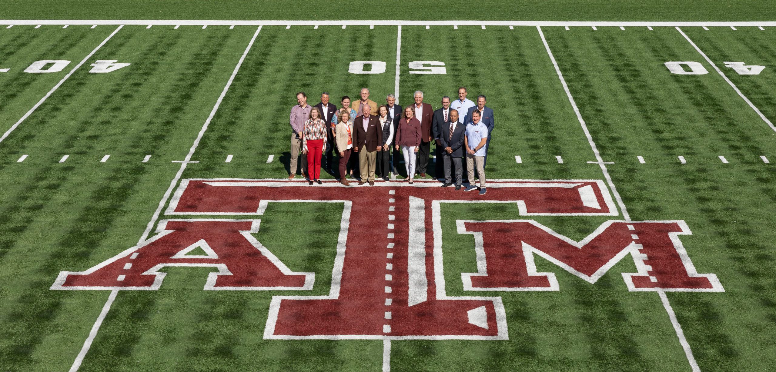 Group shot of development council on drill field