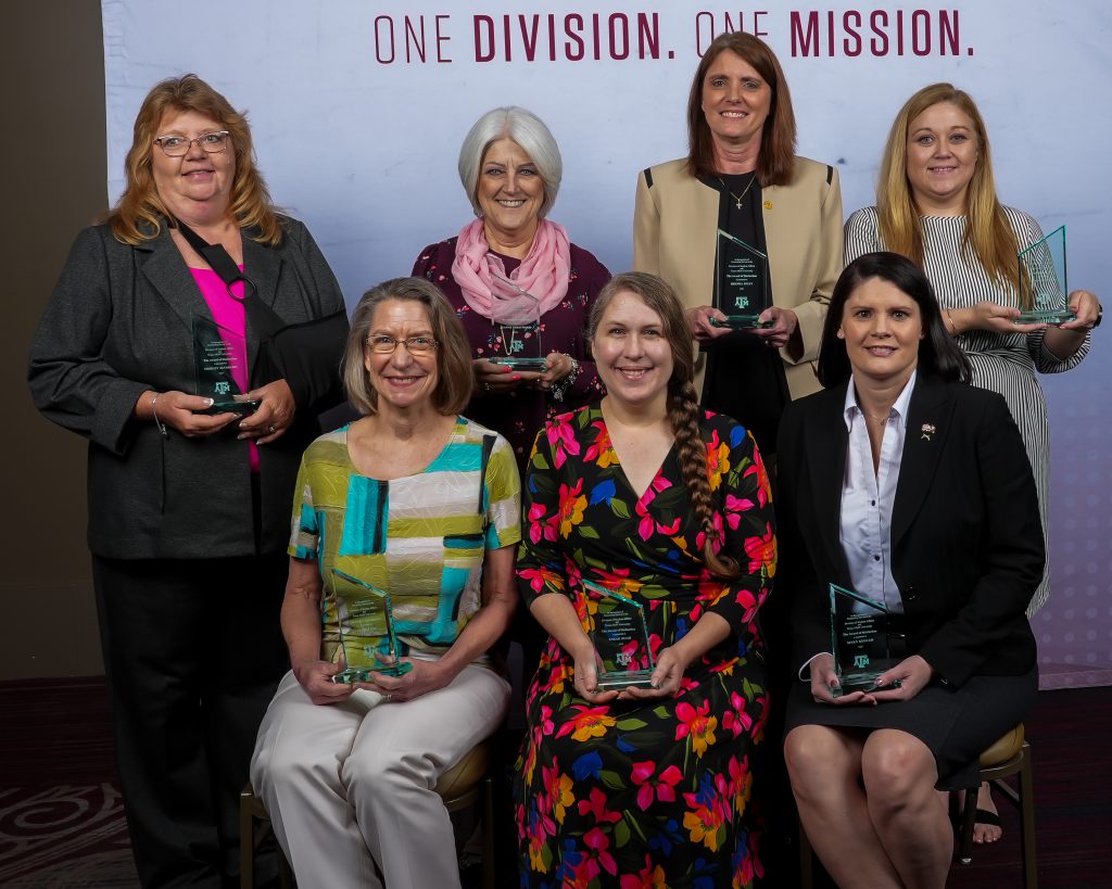 Photo of the In Person New Student Conferences Implementation Team holding their DSA awards