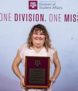 Photo of Suzanne Swierc holding their DSA Award.
