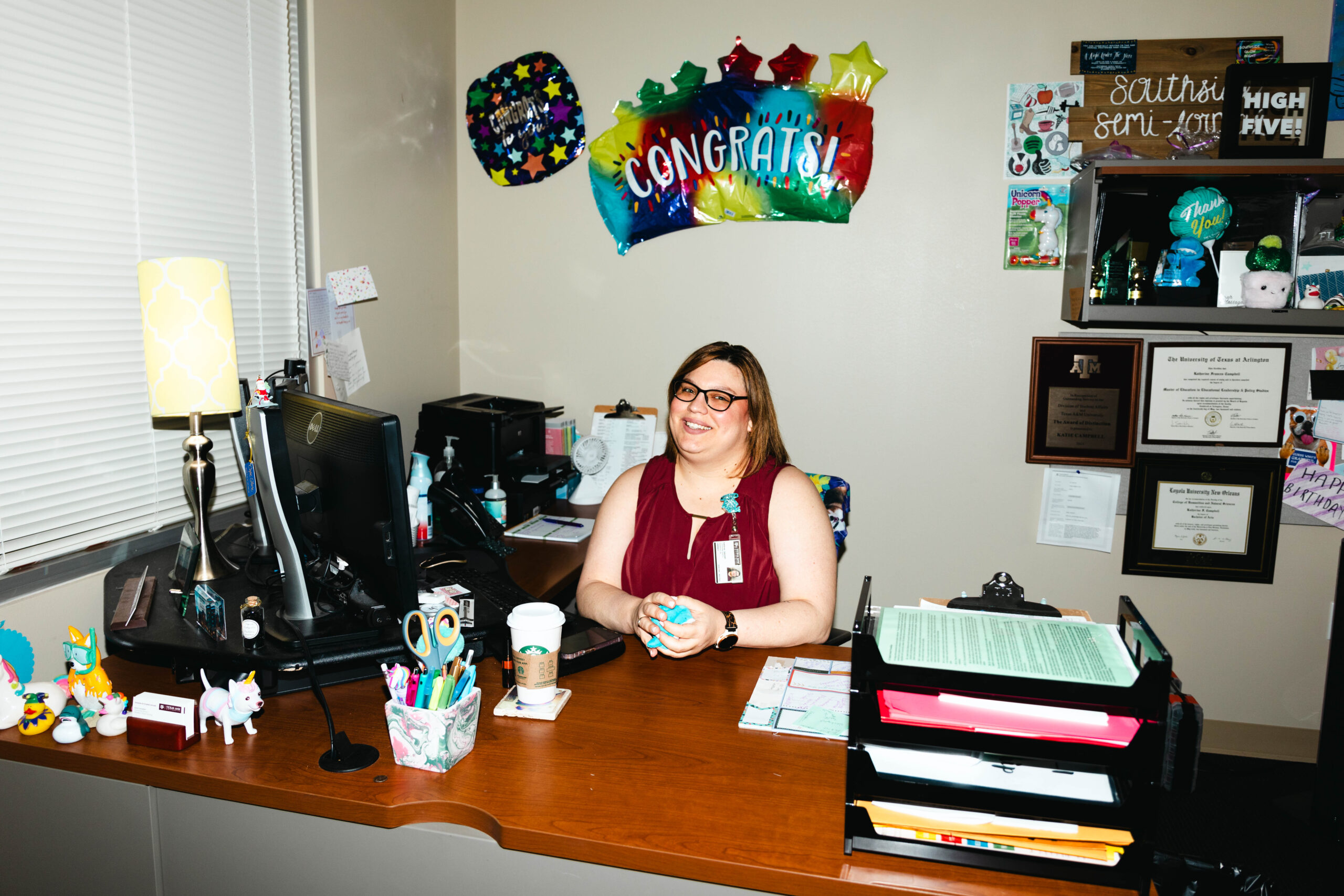 Katie Campbell at her desk in her office in Hullabaloo Residence Hall