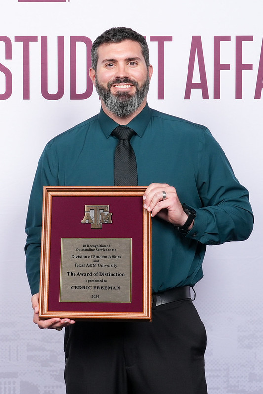 Kyle McCracken with Cedric's award on his behalf