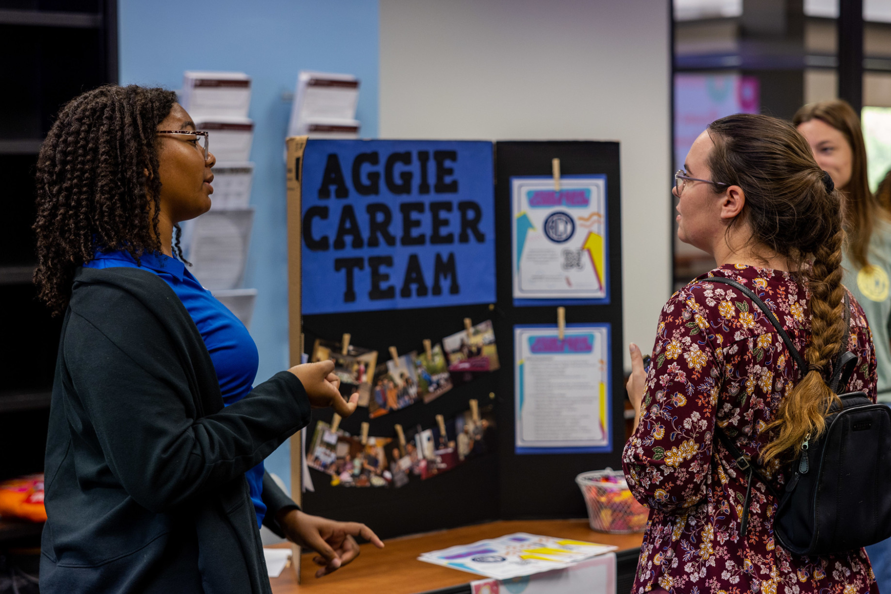 career center staff member talking to a student