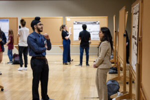 students participating in the student research week poster presentations