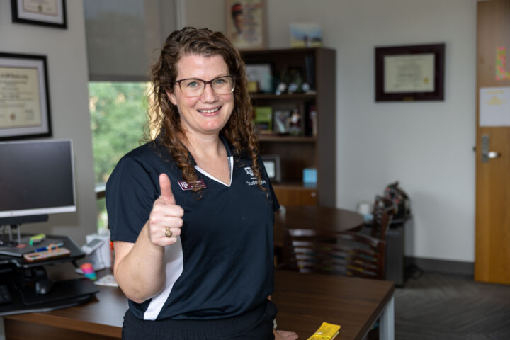 Dr. Libby Daggers posing in her office