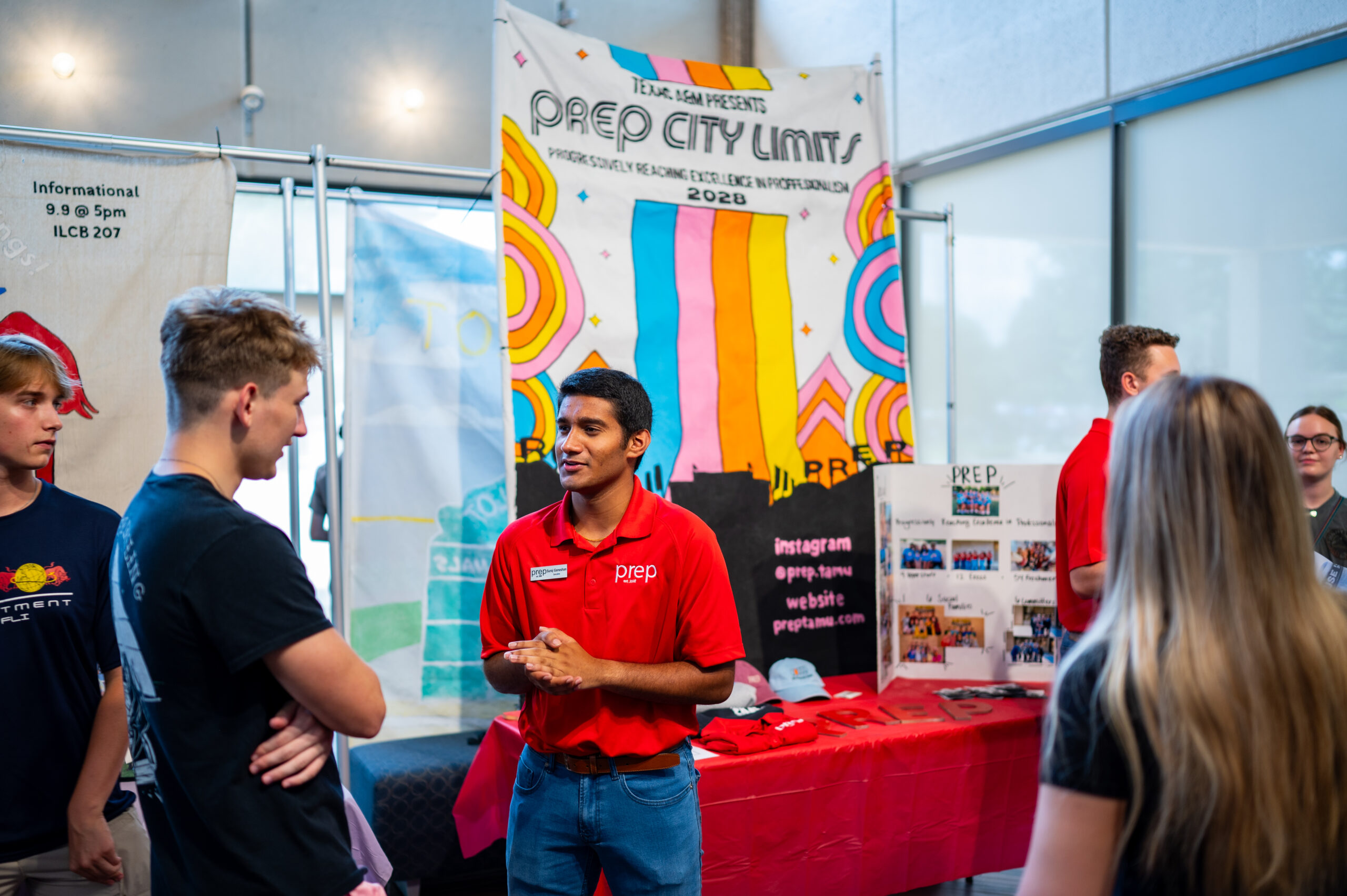 Student organization representative talking to interested students at MSC Open House
