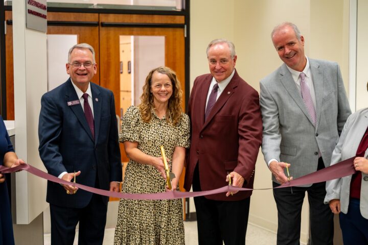 Dr. Bill Kibler, Dr. Kristie Orr, President Mark Welsh, and Dr. Alan Sams cut a maroon ribbon at the West Campus Testing Center grand opening