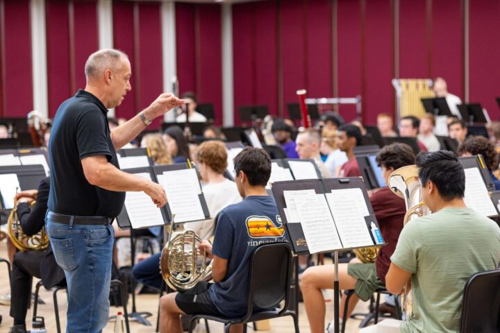 Dr. Tim Rhea conducting a university band group