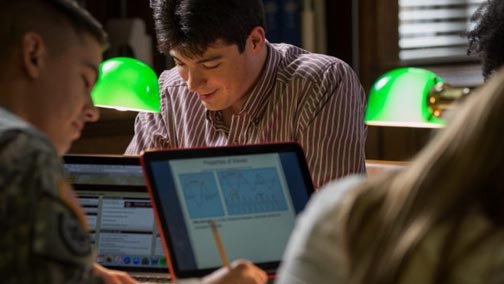 Student studying in a campus study area.