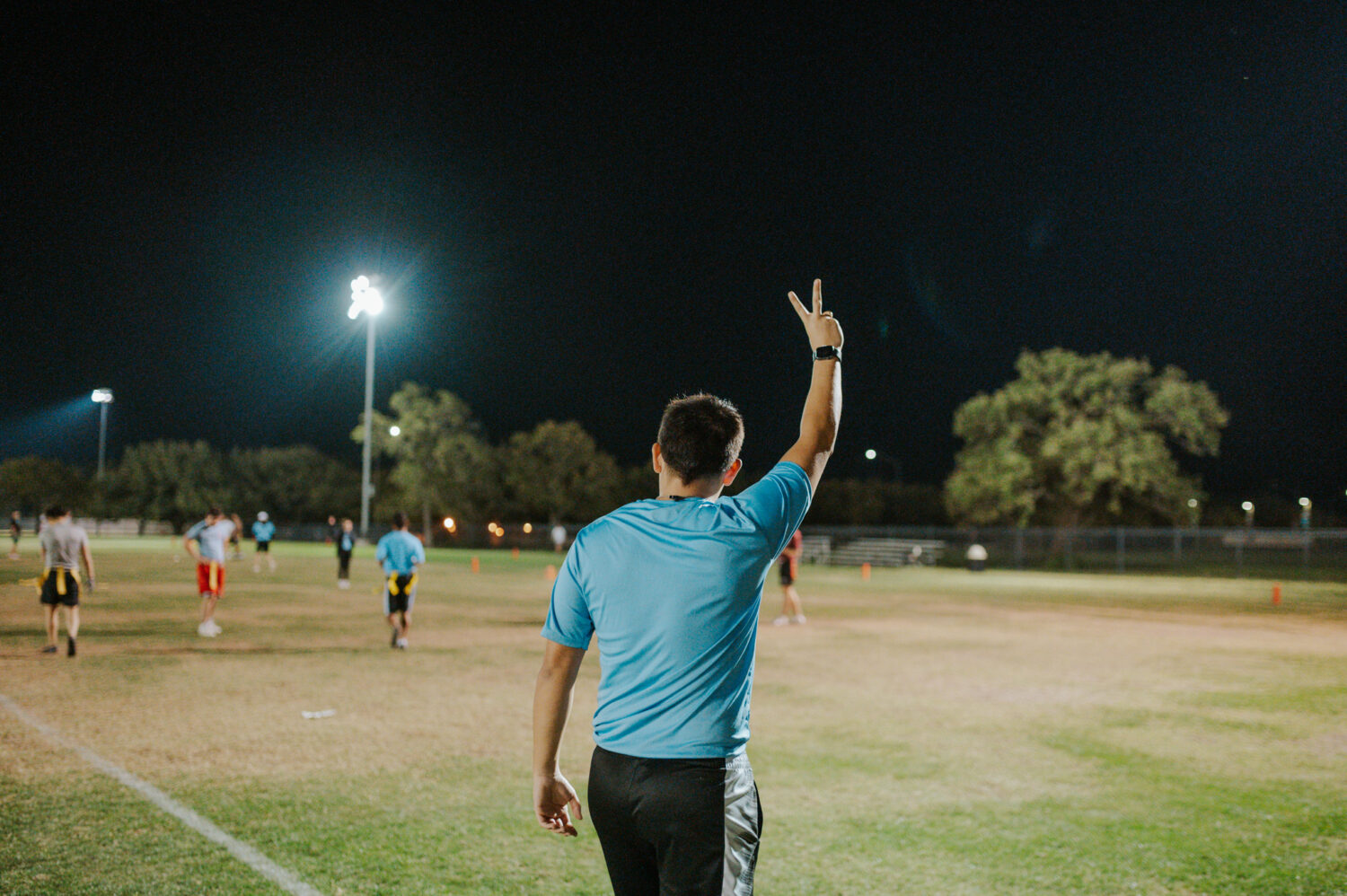 Photo of Matthew Amézaga refereeing intramural sports.