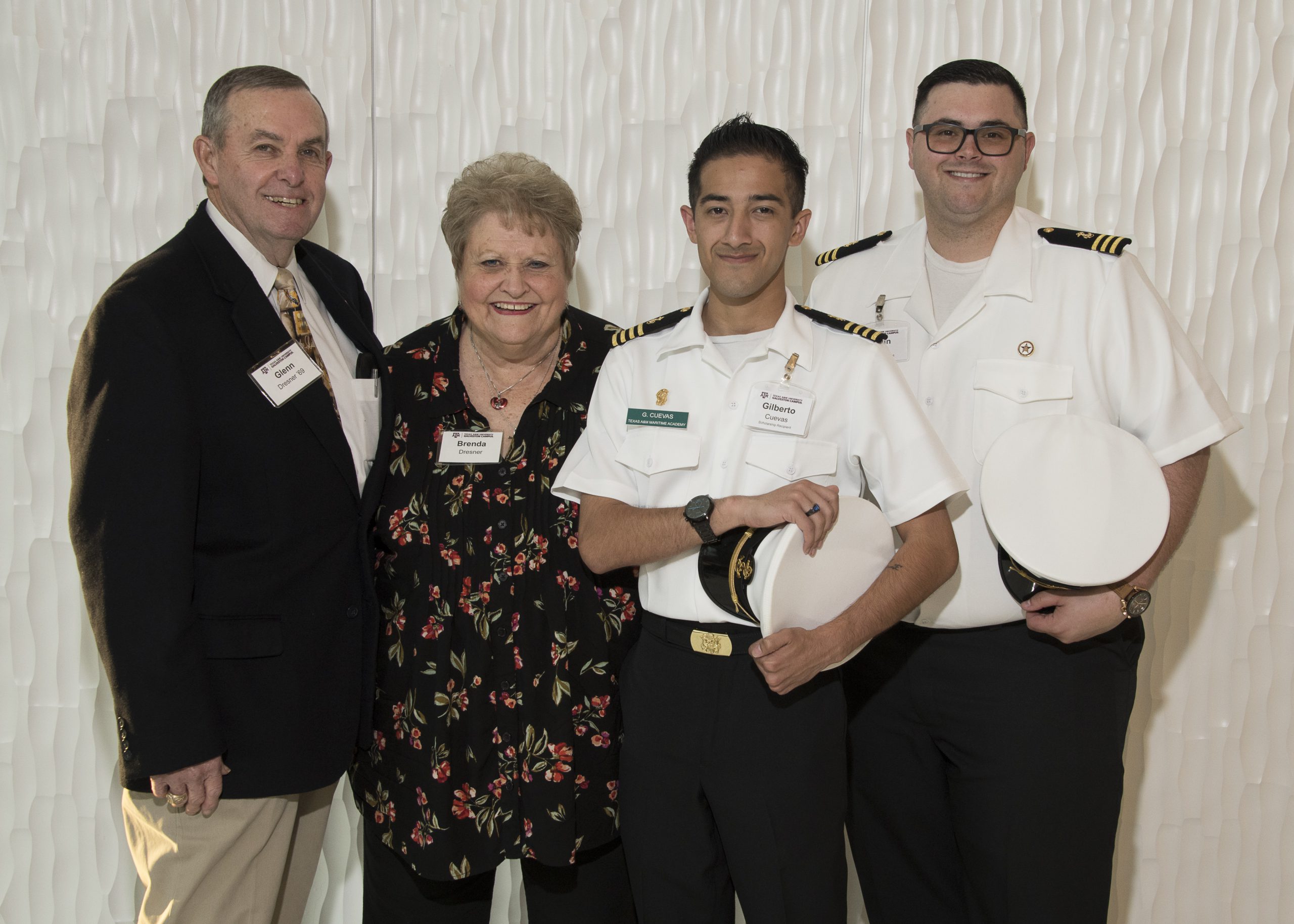 Photo of Brenda and Glenn Dresner with two students