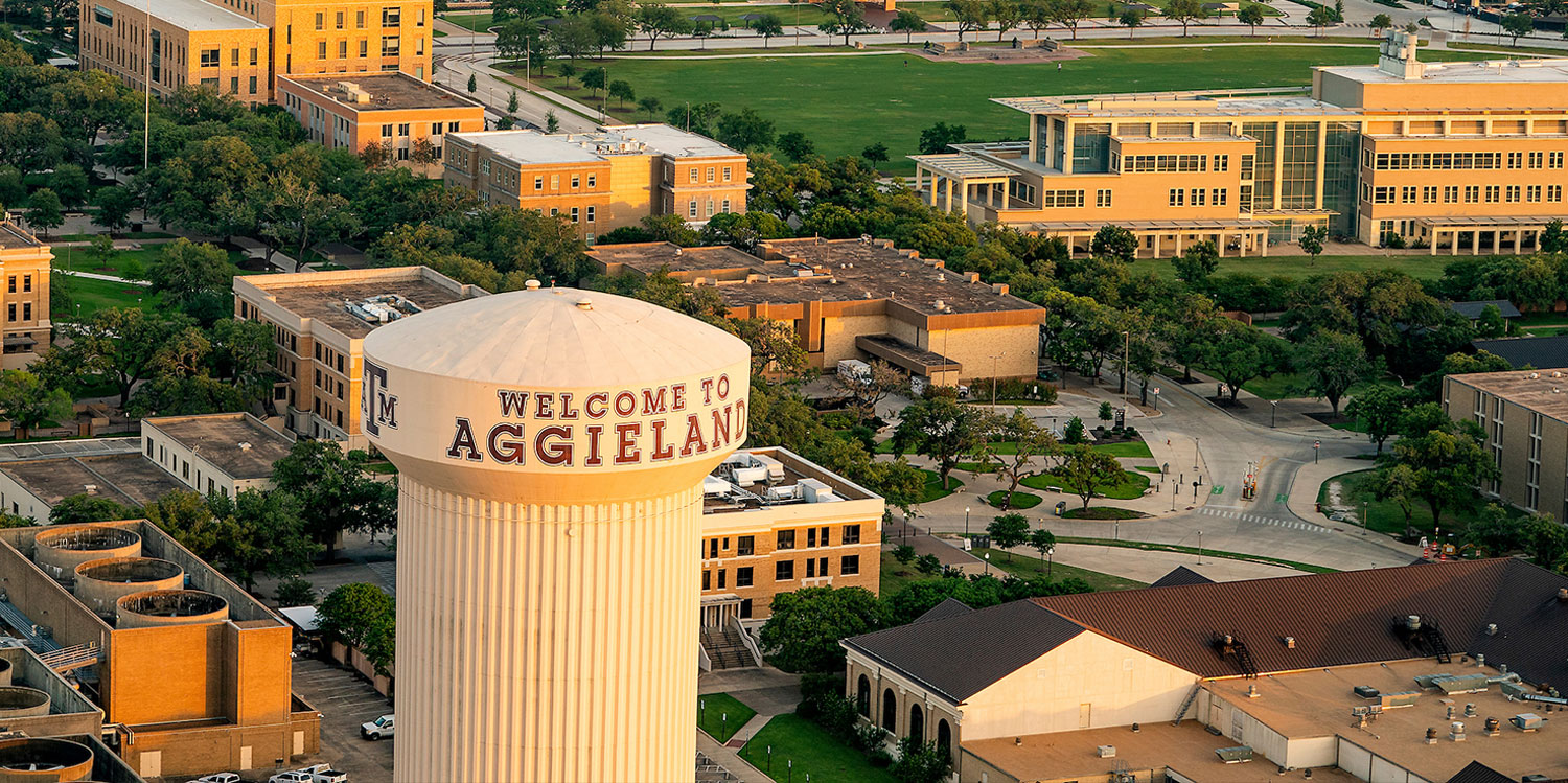 Aerial view of Aggieland including the Welcome to Aggieland Watertower with the Student Services Building and ILCB in the background.